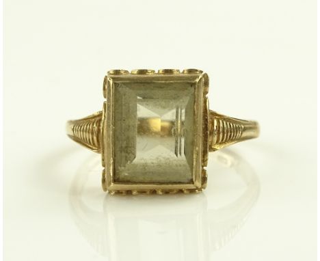 A 9ct gold square topaz set ring, setting height 11mm, size K.