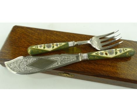 Pair of Victorian plated and engraved fish servers with ceramic handles, cased.