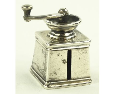 A Victorian unmarked silver novelty tape measure in the form of a coffee grinder, by Jones of St. James Street, London, heigh