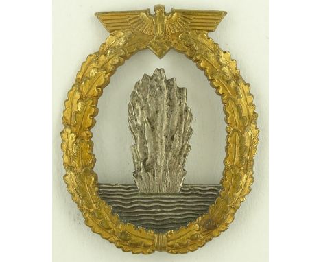 A German Third Reich brass and nickel plate Mine Sweeper badge, marked R K.