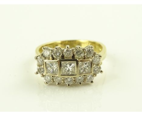 An 18ct gold Princess and brilliant-cut diamond ring, total diamond content approx. 0.7cts, setting width 15mm, size K.