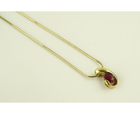 An 18ct gold ruby set pendant on a 9ct chain.