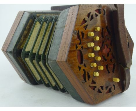A 19th century mahogany accordion, original mahogany case.