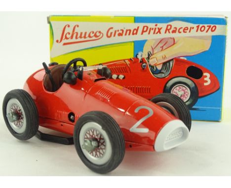 A Schuco clockwork toy Grand Prix racing car, model no. 1070, original box, length 16cm.