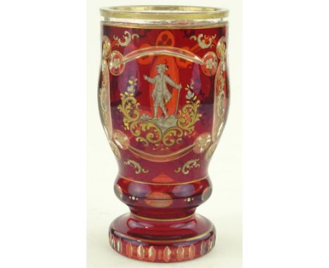 A 19th century Bohemian ruby overlay gilded glass goblet with painted figures, height 15cm.