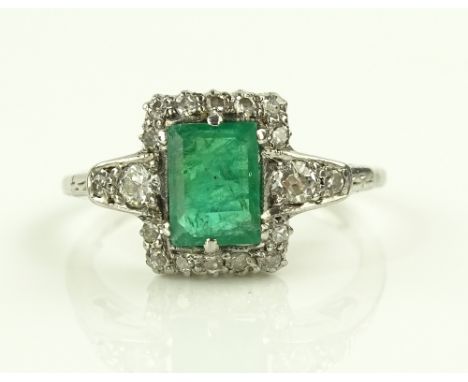 A platinum square-cut emerald and diamond cluster ring, setting height 10mm, size K.