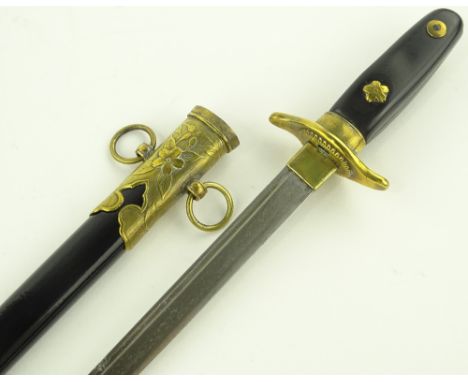 An early 20th century continental dagger, composition hilt with brass mounts and original brass mounted scabbard, overall len