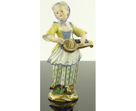 A Meissen porcelain figure of a young girl playing a hurdy- gurdy, blue under glaze cross swords mark, a/f.