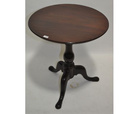 An Antique circular mahogany tea table on tripod base, diameter 26.5".