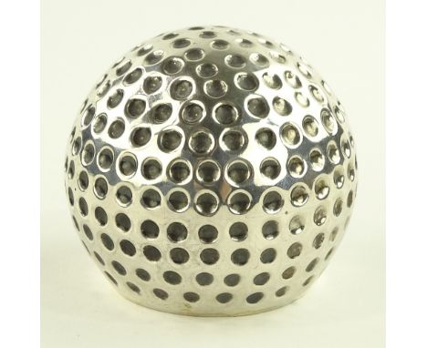 A modern silver golf ball design novelty table lighter, diameter 7.5cm.