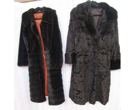 A vintage black faux astrakhan coat with black mink collar and deep cuffs, double breasted and waisted, with a vintage black 