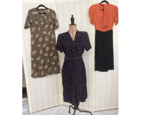 Mixed vintage dresses to include brown cocktail dress labelled Carnegie, with black embroidery, white button detail, a pleate