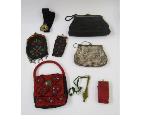 A black vintage evening bag labelled 'Oroton', black enamel and gilt metal fixed frame with single handle, black snake style 