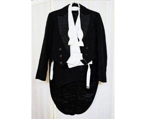 Vintage tail coat, with white poplin waistcoat, white tie and a stiff collar, also a pair of evening trousers, and a collecti