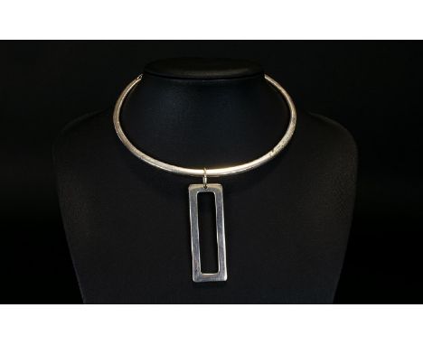 A Vintage Phillipe Audibert Torque Necklace Minimalist style statement necklace in white metal with large central rectangular