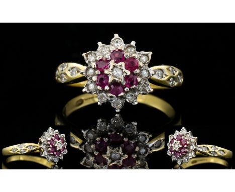 18ct Gold Ruby and Diamond Cluster Ring. Flower head Setting, Diamond Shoulders. Fully Hallmarked for 750. The Ruby's and Dia