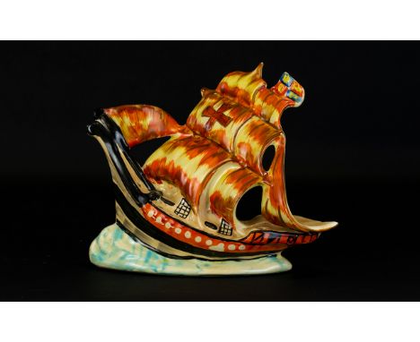 Arthur Wood Ceramic Figure in the form of HMS Nelson circa 1930's on an oval base, loosely hand painted in yellow, orange and