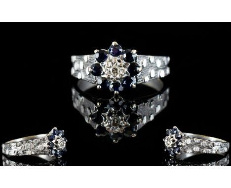 Ladies 18ct White Gold Sapphire and Diamond Dress Ring, Flower head Setting. The Single Stone Diamond Surrounded by 8 Sapphir