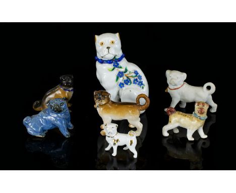 A Collection Of 19th/20th Century Ceramic Pug Figurines Mostly continental, some with indiscernible marks to underside, to in