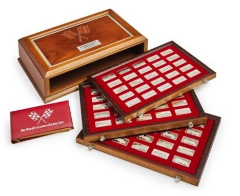 'The World's Greatest Racing Cars'- Franklin MintWooden box with three drawers, containing 75 silver ingots of the most famou