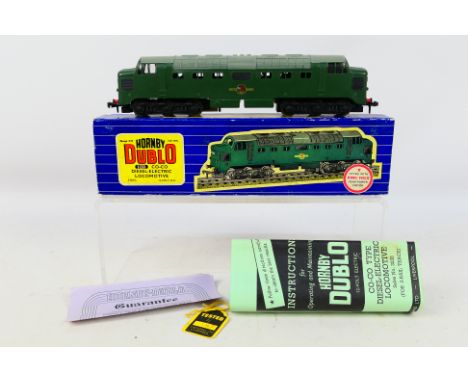 Hornby Dublo - A boxed CO-CO Diesel Electric locomotive in British Rail plain green livery # 3232. The model appears Near Min