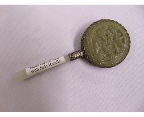 A Chinese jade and white metal hand mirror