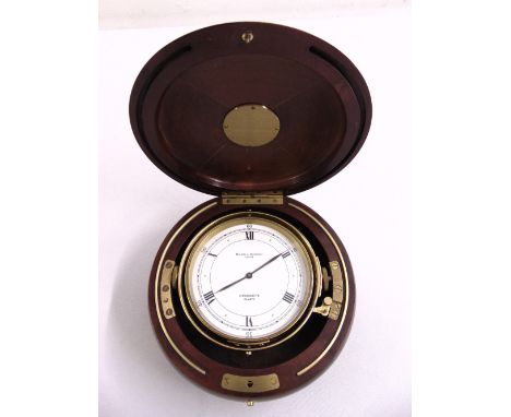 Baume Mercier circular quartz chronometer in polished wood and gilt case