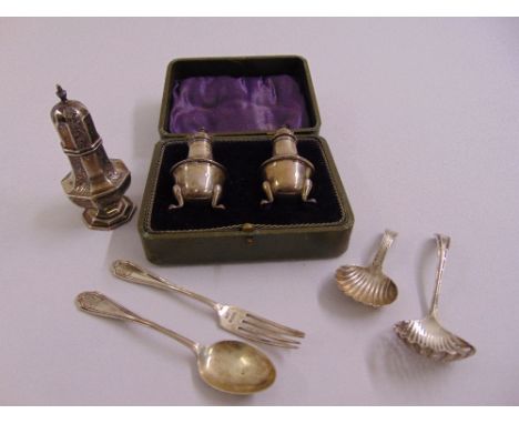 A quantity of silver to include a pair of footed salts in presentation case Birmingham 1919, a scroll embossed sugar sifter B
