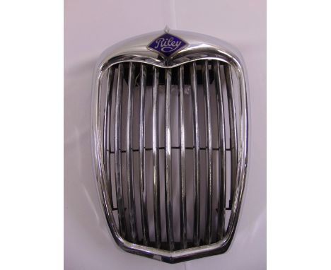 A Riley motor car grill with enamel badge