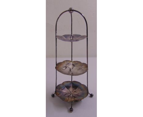 A Mappin and Webb silver three tier chocolate stand, the wirework frame supporting three graduated circular dishes all on fou