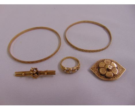 A quantity of 9ct gold jewellery to include two bangles, two brooches and a ring, approx total weight 23.4g