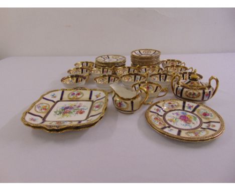 Paragon early 20th century tea service for twelve place settings to include cups, saucers, plates, sandwich plates, a cake pl