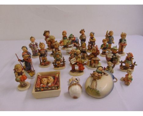 A quantity of Hummel and Goebel figurines and three wall plaques  (27)