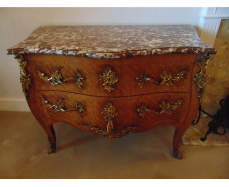 A French Louis XVI style commode of shaped rectangular form with two drawers and marble top