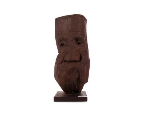 * IAIN R MCINTOSH RSA (SCOTTISH b. 1945), THE GREEK PRIEST oak sculpture, carved signature (MCINTOSH) and dated '77 on the si