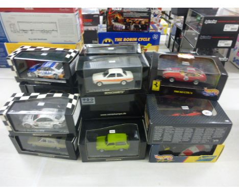 A collection of sixteen boxed and cased die cast scale model cars to include; thirteen Minichamps Paul Model Art; to include 