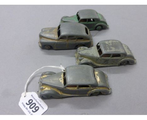 Four vintage play worn diecast Dinky vehicles to include Riley x 3 and Vanguard
