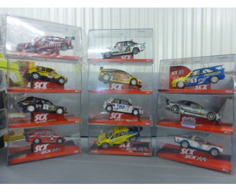 11 Boxed SCX Rally Slot Cars 1:32 Scale to include; Ford Escort RS Cosworth, Fiat 131 Abarth, Seat Fura most in nr mint unuse
