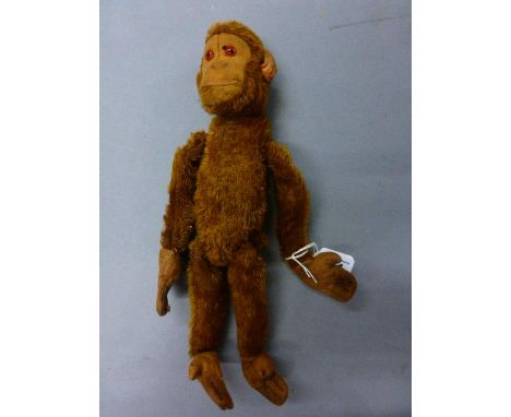 Sawdust filled vintage Monkey soft toy with repair to leg