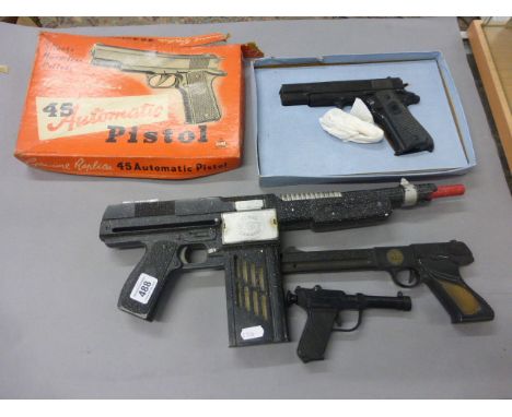 Four plastic vintage toy guns to include a boxed Bell 45 Automatic  Pistol