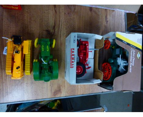 Boxed ERTL John Deere Overtime Tractor 1/16 and boxed ERTL 1/16 McCormack Farmall Super Tractor plu two unboxed John Deere ER