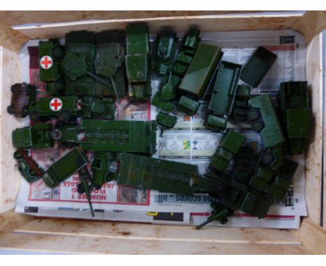 A collection of approximately twenty four vintage play worn Dinky die cast models relating to the Army 