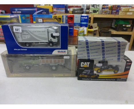 Four boxed die cast model trucks to include; 1:50 scale Norscot Scale Model Caterpillar Sponsored European Racing Truck, 1:43