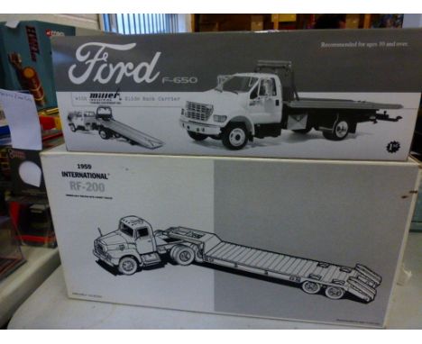 Two boxed First Gear die cast commercial vehicles comprising Ford F-650 with Miler Industries Towing Equipment and 1959 Inter