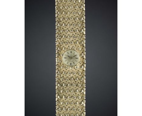 A LADIES 9CT SOLID GOLD OMEGA BRACELET WATCH CIRCA 1960s Movement: Manual back-wind, signed Omega, numbered.Case: Width appro