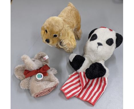 A Steiff Cockie Cocker Spaniel with working squeaker along with two hand puppets to include Steiff elephant example and one o