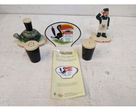 Guinness advertising ceramics to include two Carlton ware figures, a Royal Doulton name stand and a salt and pepper pot, and 