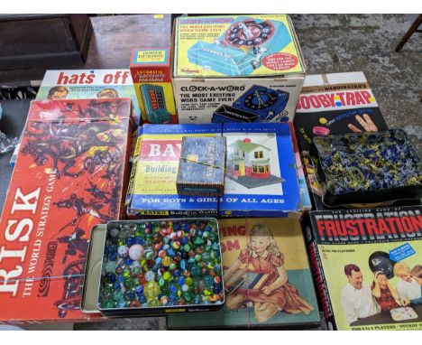 A selection of vintage board games to include Risk, Frustration, and Booby Trap, a Clock a Word, Peter Pan automatic chocolat