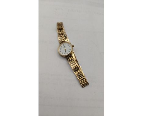 A 9ct gold ladies manual wind wristwatch and a 9ct gold bracelet, total weight 13.1gLocation: 
