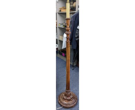 An early 20th century mahogany standard lamp having a reeded column and carved base, 137cm h Location: 